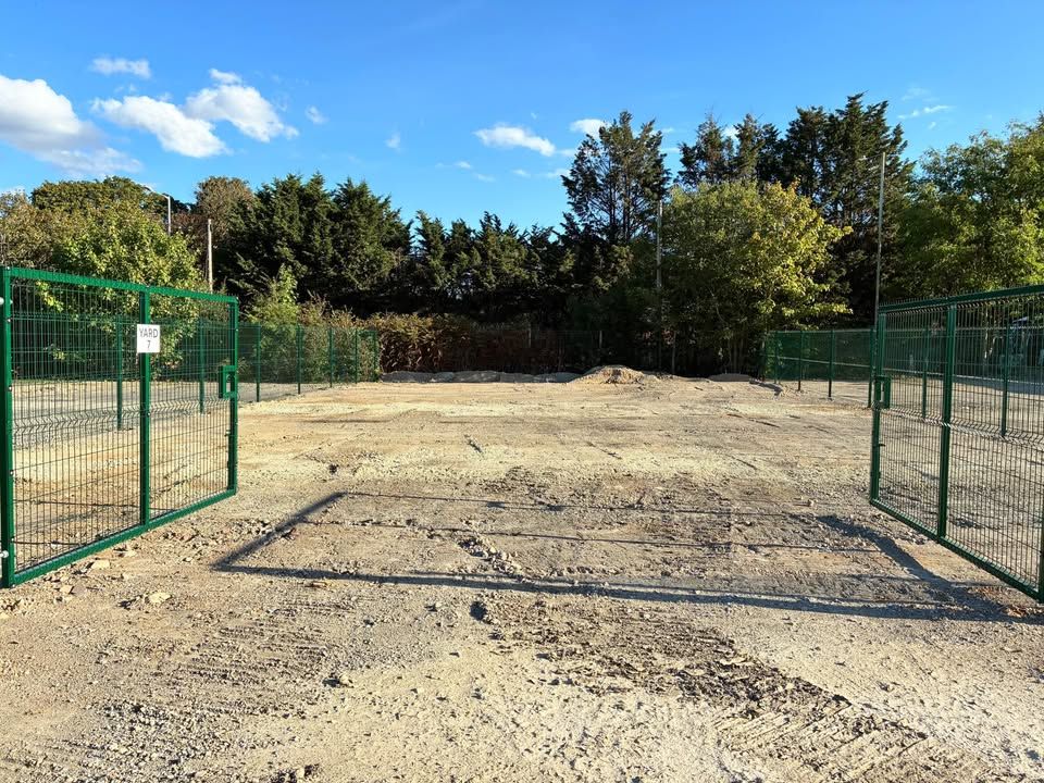 Open gravel hardstanding with room for trailers and materials
